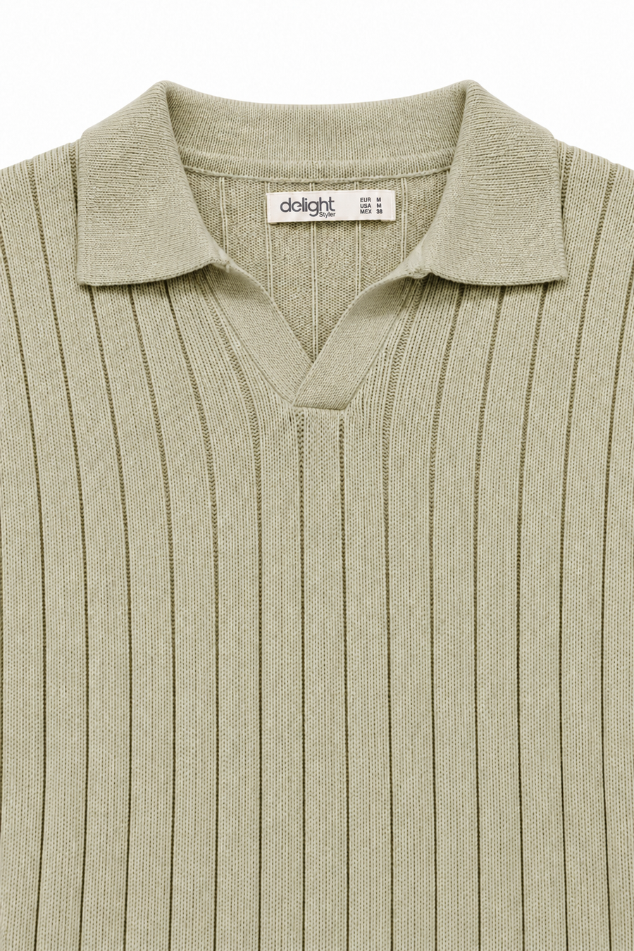 Close-up of sage green polo showing the buttonless collar and vertical knit texture